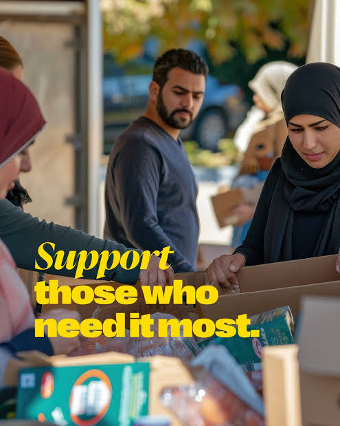 Volunteers packing boxes of food and supplies for families in need