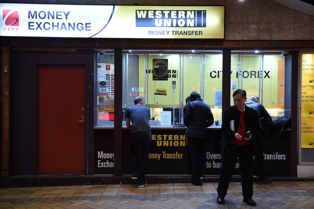Western Union money transfer agent counter with customers being served